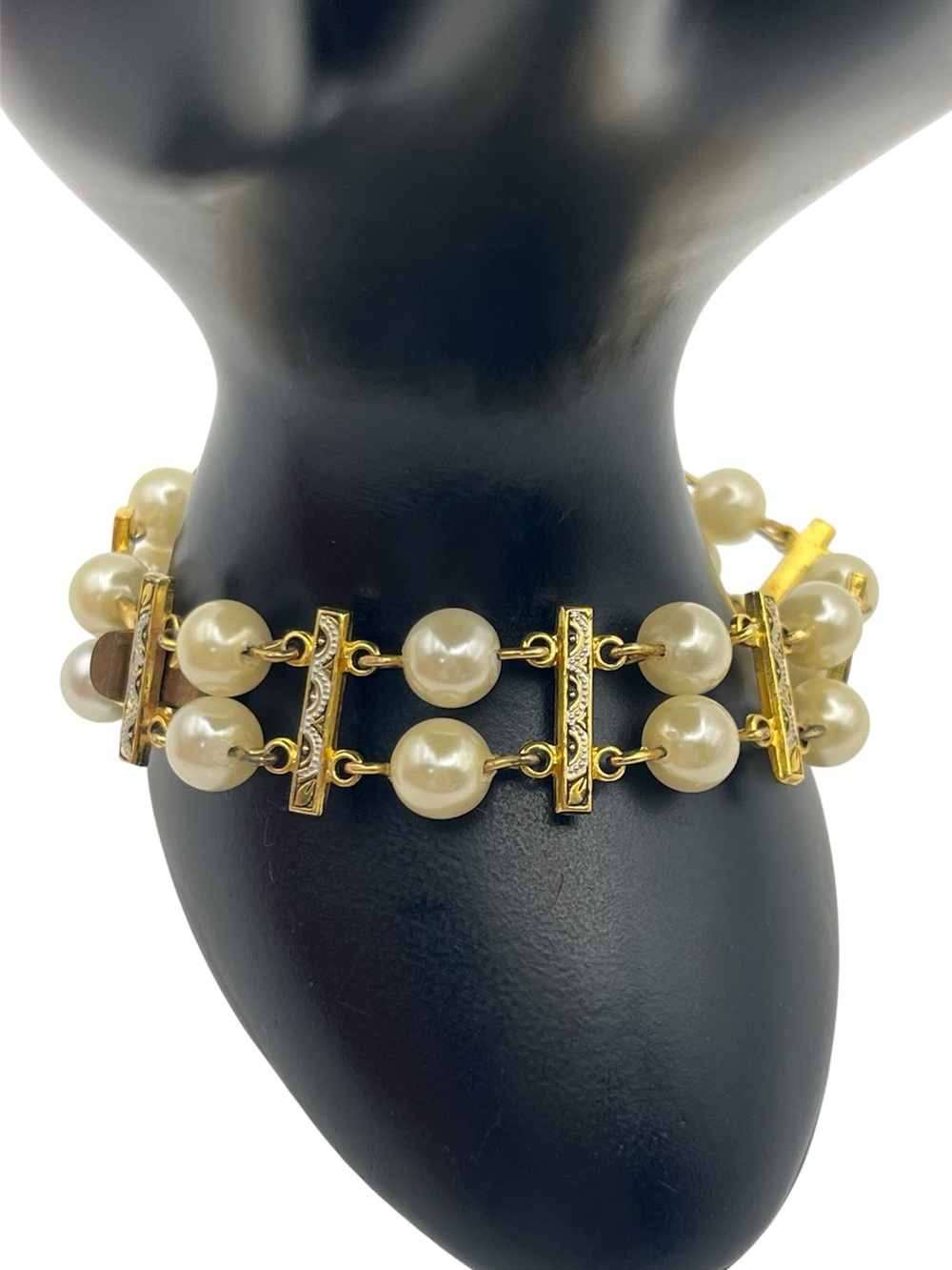 Gold tone double faux pearl strand chain bracelet w black enamel detailing